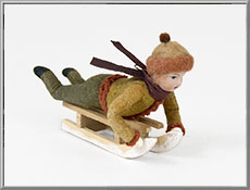 Vintage Christmas ornament 'Neil on a Sled'
