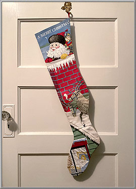 Vintage 1986 'A Merry Christmas' cloth Christmas stocking from The Toy Works