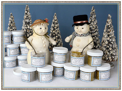 Snowman and snow lady with metallic mica flakes