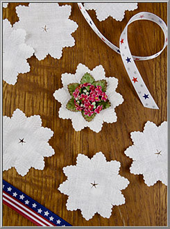 'Blumenmanschetten' vintage flower cuffs of white fabric, made in Germany in the 1990's 
